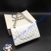 Chanel Small Classic Flap Bag in White Lambskin with silver hardware