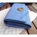 Gucci GG Marmont continental wallet in Blue leather with a chevron design