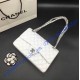 Chanel Small Classic Flap Bag in White Lambskin with silver hardware