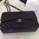 Chanel Small Classic Flap Bag in Black Lambskin with silver hardware