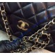 Chanel Jumbo Classic Flap Bag in Black Lambskin with golden hardware