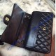 Chanel Jumbo Classic Flap Bag in Black Lambskin with golden hardware