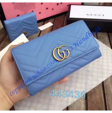 Gucci GG Marmont continental wallet in Blue leather with a chevron design